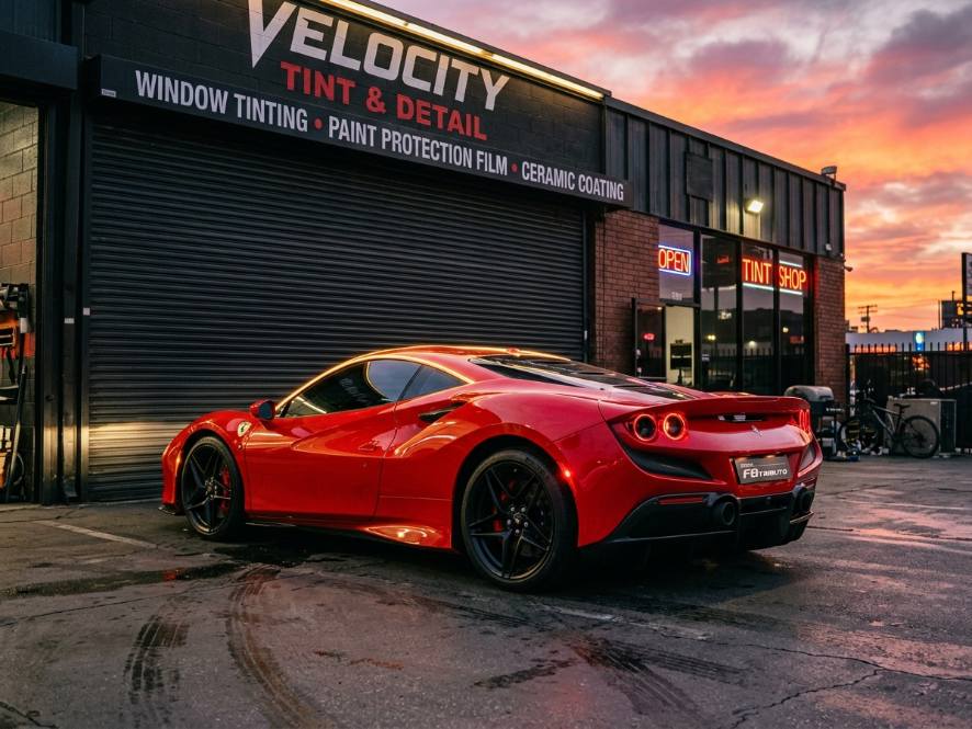 Ferrari at sunset in front of the tint studio
